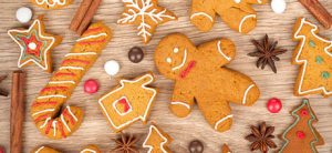 Homemade various christmas gingerbread cookies on wooden background